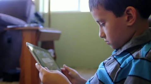 Playing game on iPad tablet Stock Footage 12296886