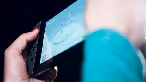 Playing games on gamepad 스톡 사진