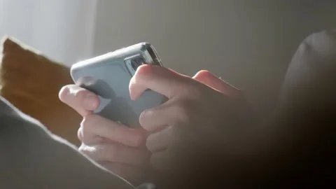 Playing games on smartphone. Stock-Footage 198738365