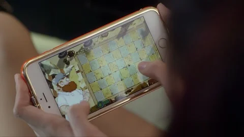 Playing games on a smartphone Stock Footage 261642286