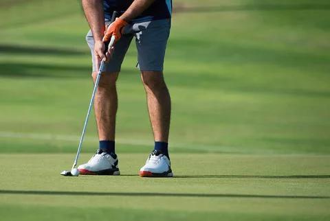 Playing golf preparing to shot Stock Photos