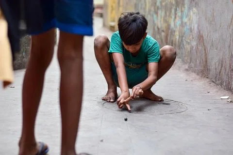 Playing goli Game Stock Photos
