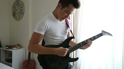 Playing guitar 2 Video stock 25420373