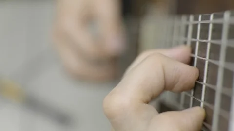 Playing guitar 4K Video stock 115335145