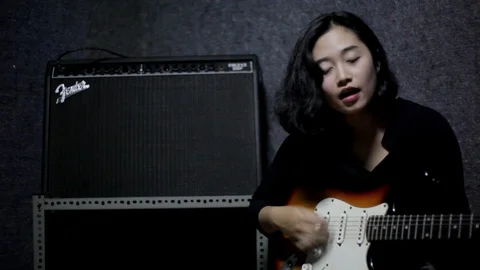 Playing Guitar and Singing Stock Footage 107404893