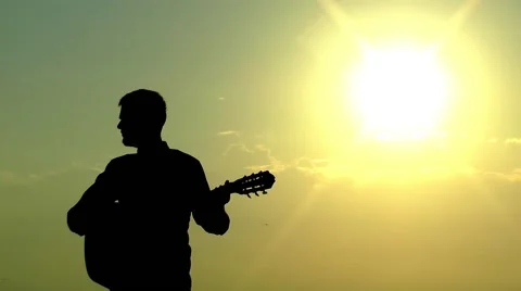 Playing Guitar and Sun Stock Footage 52182944