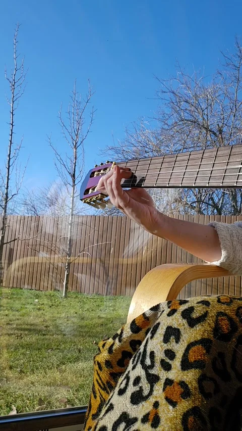 Playing guitar chords Stock Footage 296996168