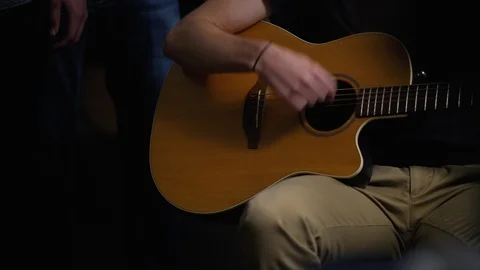 Playing Guitar Chords in a Small Group - Small Concert Stock Footage 87532940
