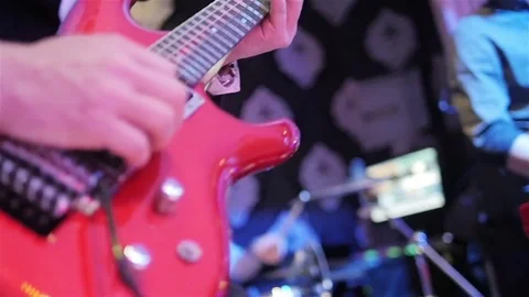 Playing guitar close up slow motion. Male hand fingers press chords holding note Stock Footage 70137020