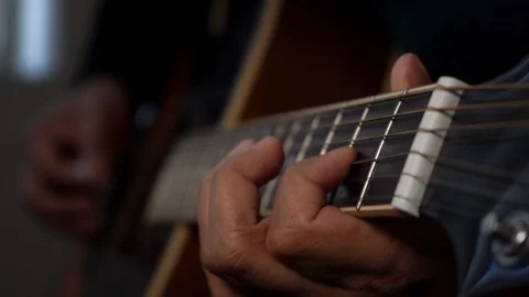 Playing guitar doing slides and bends Stockbeeldmateriaal 102507437