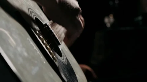Playing guitar in the evening close-up Видео 252528387
