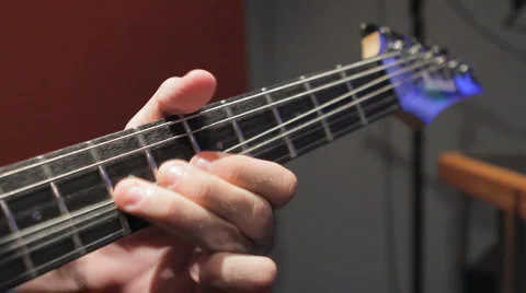 Playing on a guitar Video stock 6930407