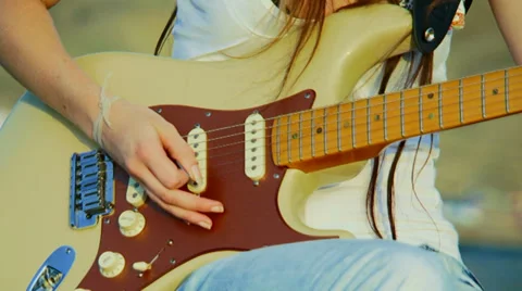 Playing guitar Stock Footage 32243239