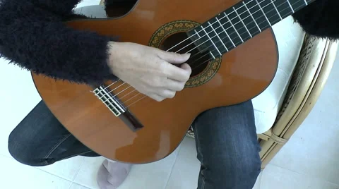 Playing a Guitar Stock Footage 44852808