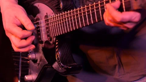 Playing  guitar Stock-Footage 105691596