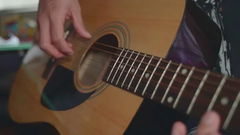 Playing guitar Stock Footage 151091454