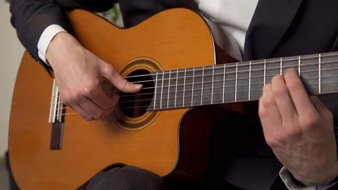 Playing the guitar Stock Footage 196155430