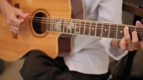 Playing guitar Stock Footage 301571174