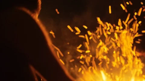 Playing a guitar in front of camp fire Stock Footage 109480559