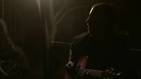 Playing guitar at night Stock Footage 71136192