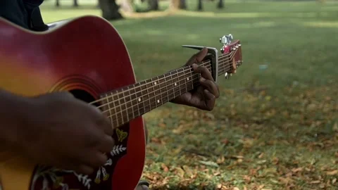 Playing guitar outdoors Stock Footage 236200851