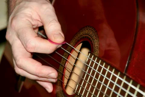 Playing on a guitar Stock-Fotos