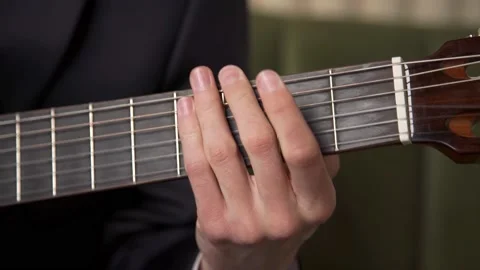 Playing the guitar. picking chords. close-up Stock Footage 196155427