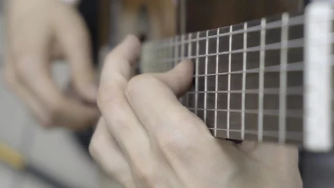 Playing guitar. Slow motion Stock Footage 126618439