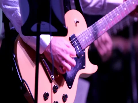 Playing Guitar on Stage - Hand Held Shot Stock Footage 74345544