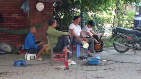 Playing guitar on the street Stock Footage 69186552