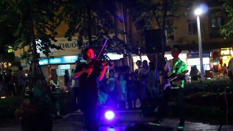 Playing guitar on the street Stock Footage 69186711