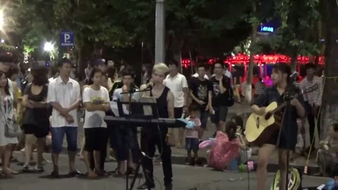 Playing guitar on the street Stock Footage 69187078