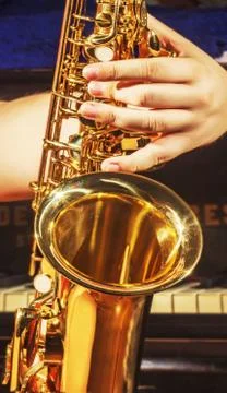 Playing hand on saxophone Stock Photos