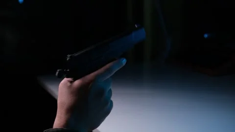 Playing with a Handgun in Hand Stock Footage 318590888