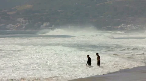PLAYING IN THE HIGH SURF Stock Footage 5683788