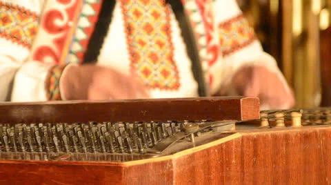 Playing  instrument dulcimer Stock Footage 24578028