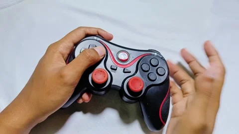 Playing joystick console game Stock Footage 285571108