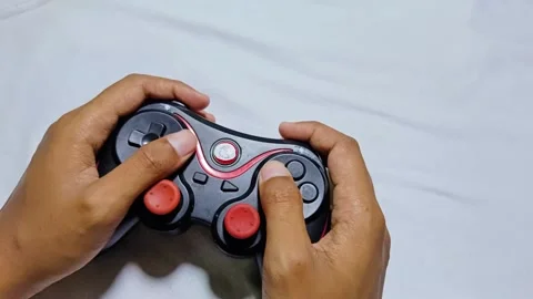 Playing joystick console game Stock Footage 285571129
