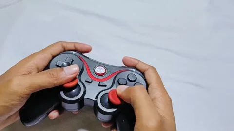Playing joystick console game Stock Footage 285571133