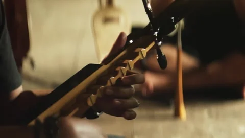 Playing kecapi traditional Bugis Makassar string instrument Stock-Footage 345860305