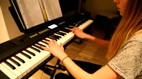 Playing on a keyboard Stock Footage 35503008