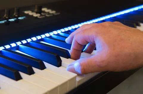 Playing a keyboard Stock Photos