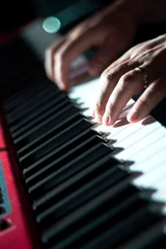 Playing keyboard player. Hands on keys. Stock Photos