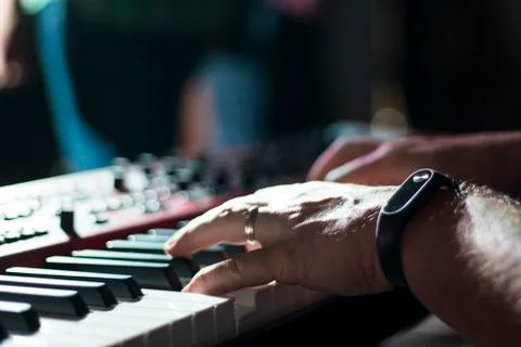 Playing keyboard player. Hands on keys. Stock Photos