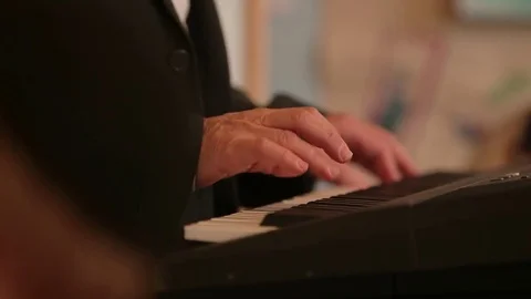 Playing keyboard song Stock Footage 77099957