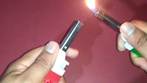 Playing with lighters Stockbeeldmateriaal 159416787