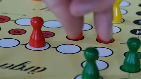 Playing ludo and throwing out a opponent Stock Footage 127922029