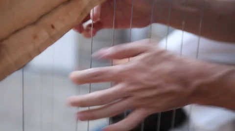 Playing a massive harp 库存影片 42868160
