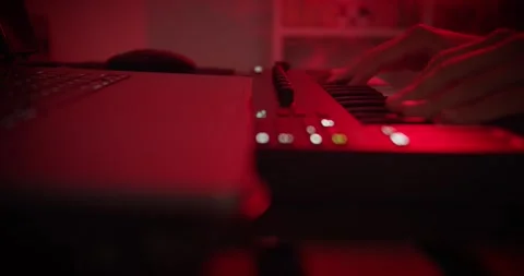 Playing on a midi keyboard Stock Footage 263536224