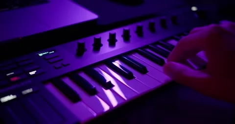 Playing on a midi keyboard Stock Footage 263536237